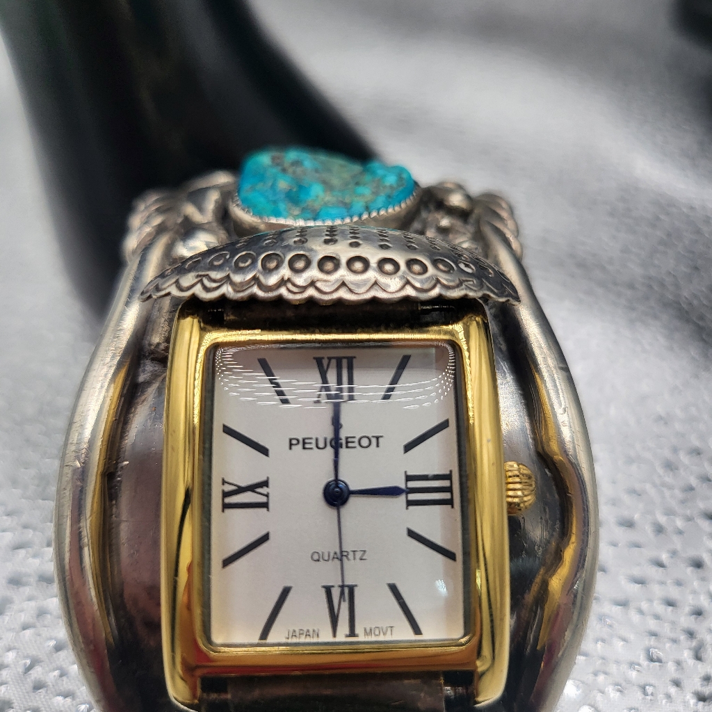 Gold And Silver Watch With Intricate Detailing